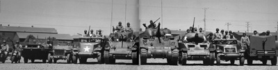 Da sinistra: due Harley Davidson WLA, una Ford GPA Seep anfibia, Willys, M3 Halftruck, M3 Stuart, M4 Sherman, M8 con obice, un M3 blindato.